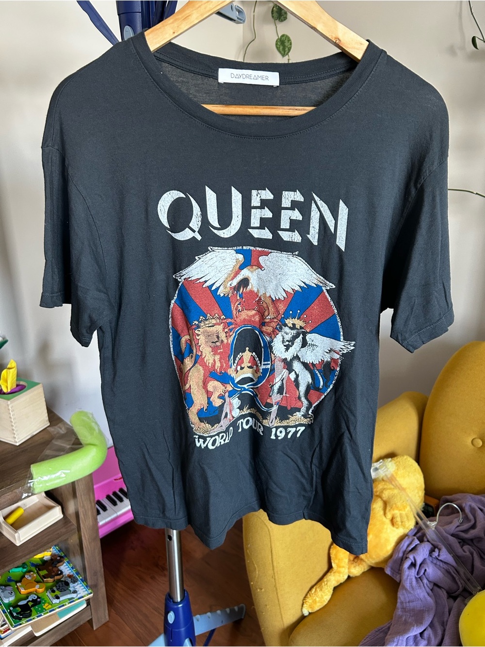 Daydreamer Black Queen Graphic Tee with Red and Blue Crest